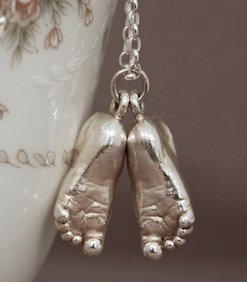 Sterling silver Baby's feet pendant ~ £654. Available with snake or cable chain.
